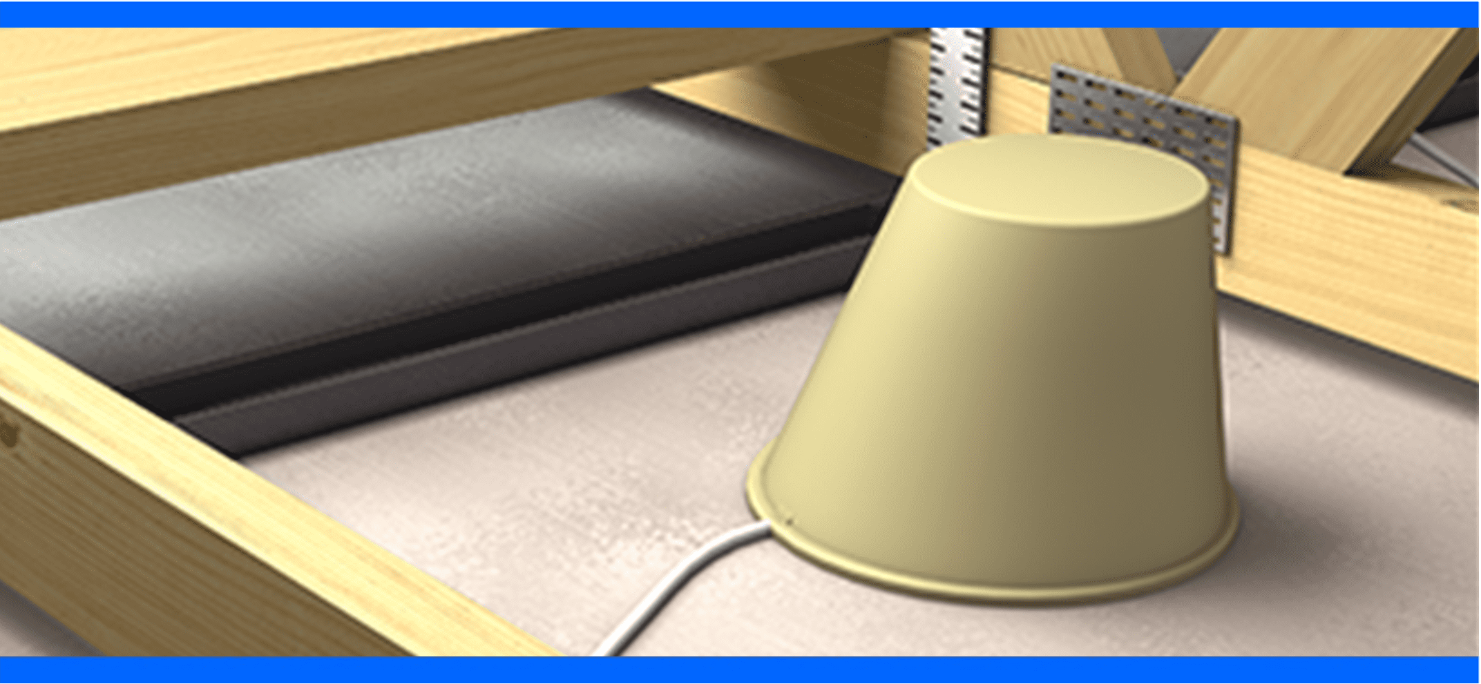 A beige plastic cup covering a white cable on a floor framed by wooden beams and metal brackets.