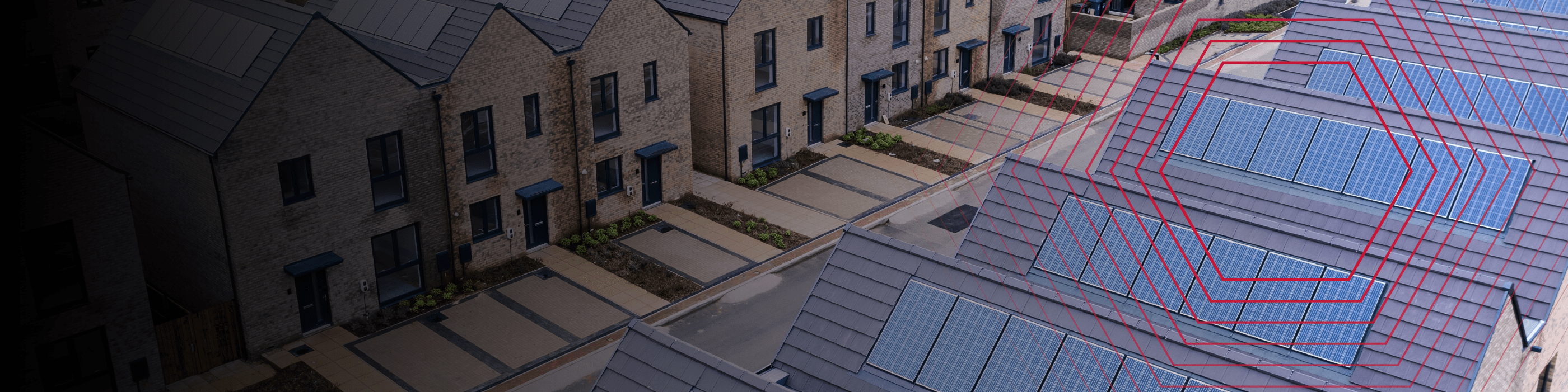 Row of modern houses with solar panels on the roofs, viewed from above, with red geometric lines overlay.