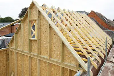 Wooden roof trusses and framing under construction on a new residential building.