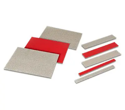 Assorted rectangular diamond sharpening stones and red backing strips arranged on a white background.