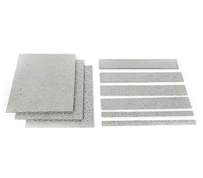 Several rectangular metal sheets and strips arranged on a white background.