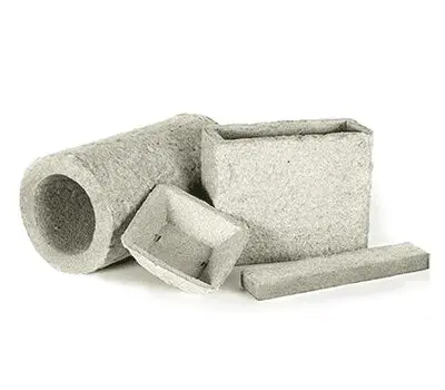 Four gray rock wool starter trays of various shapes and sizes on a white background.