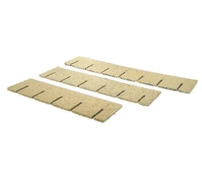 Three rectangular beige insulation panels with evenly spaced notches on one side, arranged in parallel rows.