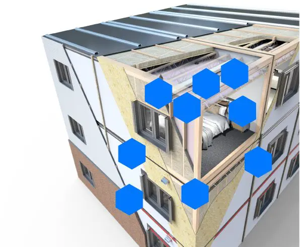 Cutaway view of a modern building corner, showing interior rooms and blue hexagons overlayed on the image.