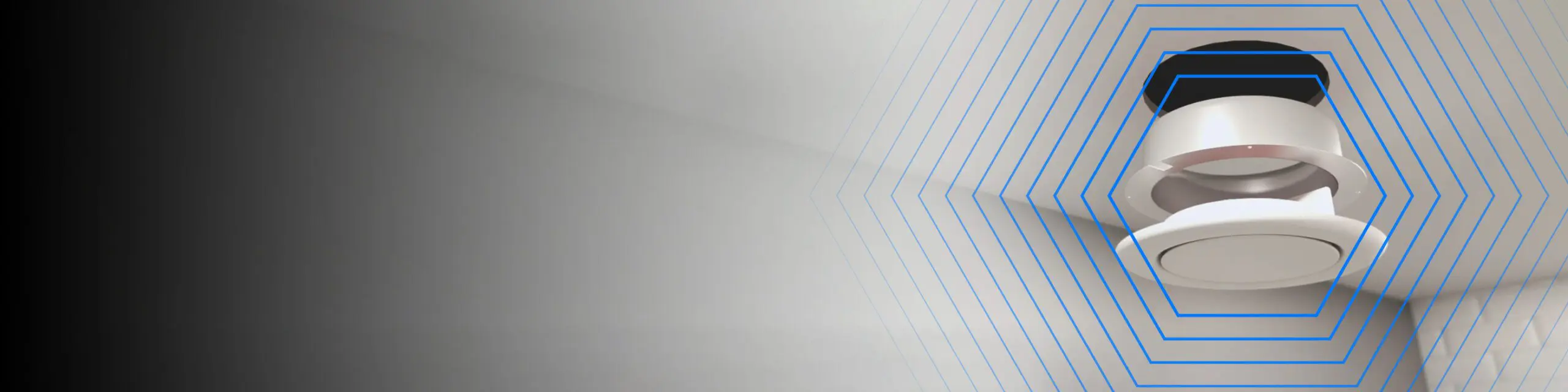 Ceiling-mounted smoke detector emitting blue concentric signal lines.