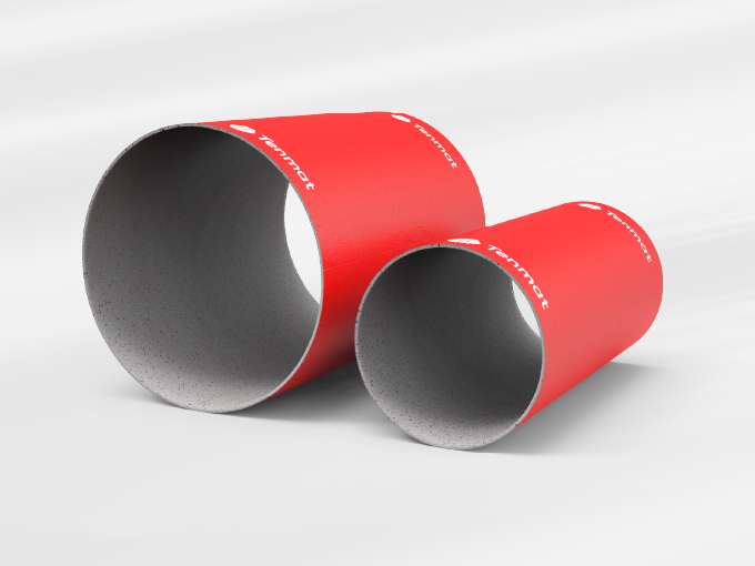 Two red tubes with gray insides rest on a white surface.