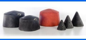 Five black and red cone-shaped and dome-shaped objects with small holes, displayed on a white background.